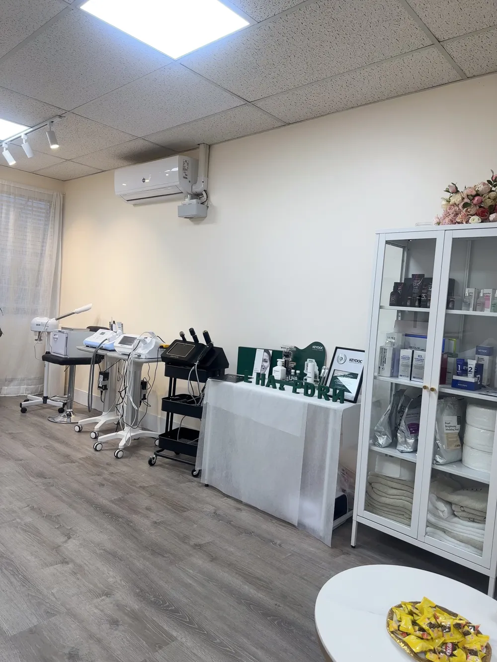 Professional skincare devices and product cabinet at COCO Beauty