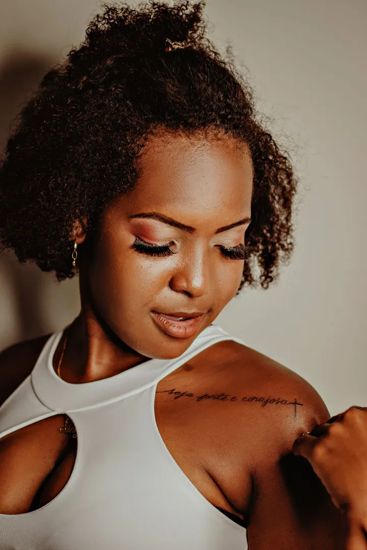 Natural glam lashes on a Black woman with curly hair